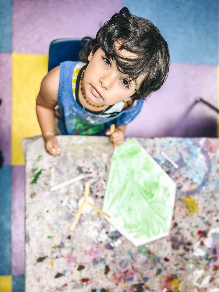 A shot of a boy from up above enjoying Willow Grove toddler art classes with Romp n' Roll. 